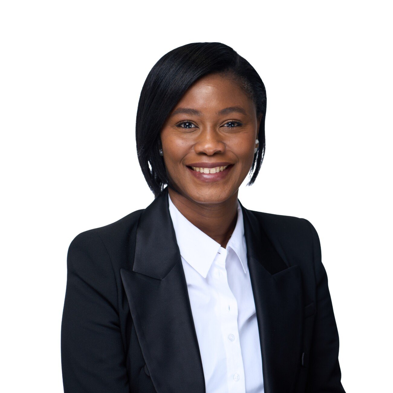 A smiling individual in a black blazer and white shirt sits against a plain white background, captured perfectly by a corporate headshot photographer. James Gifford-Mead Photography - Event Photographer London