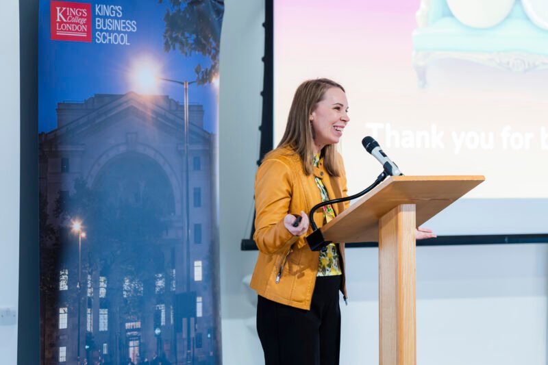 Woman speaking at King's Business School event.