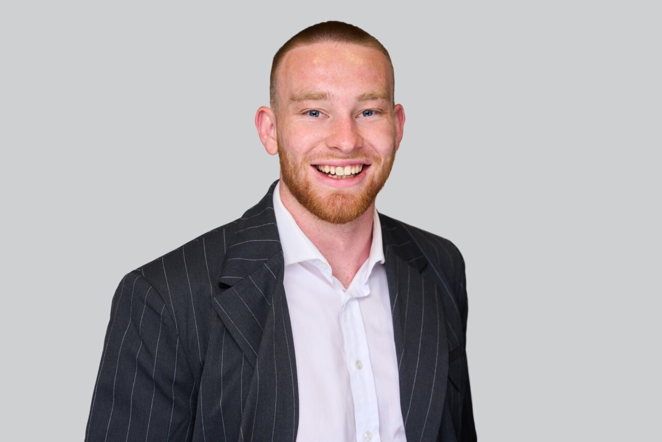 Smiling person in a suit portrait.