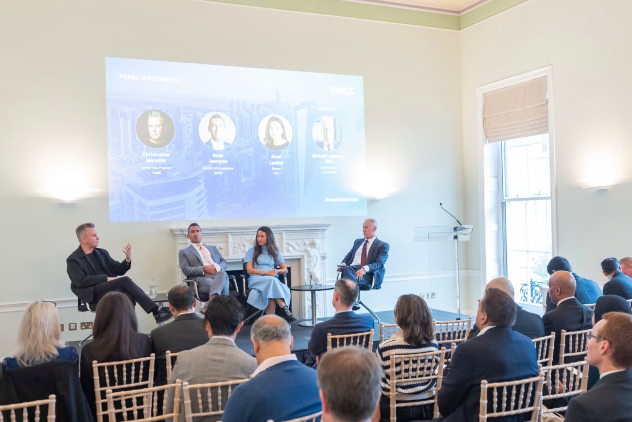 Four experts discuss business strategies at panel event.