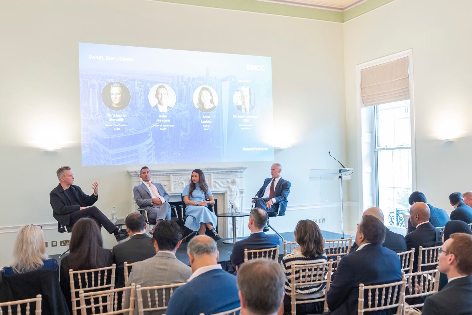 Four experts discuss business strategies at panel event.