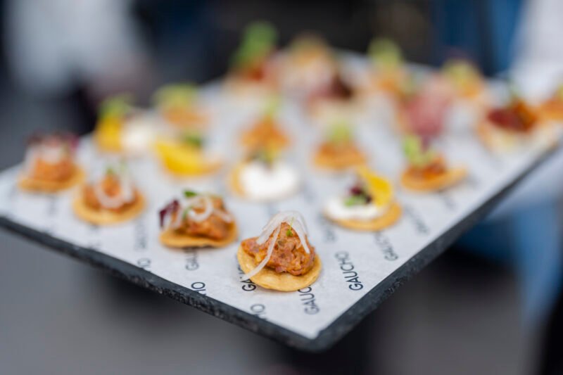 Platter of assorted canapés on a tray.
