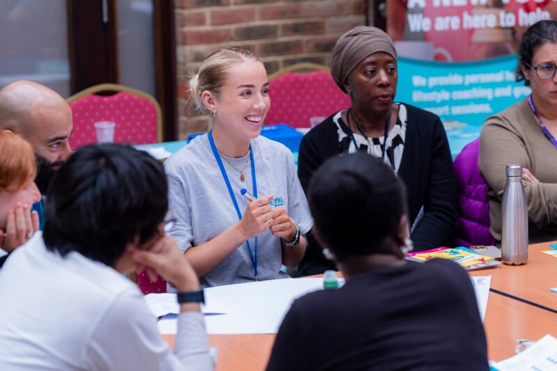 People in a group discussion at a workshop.