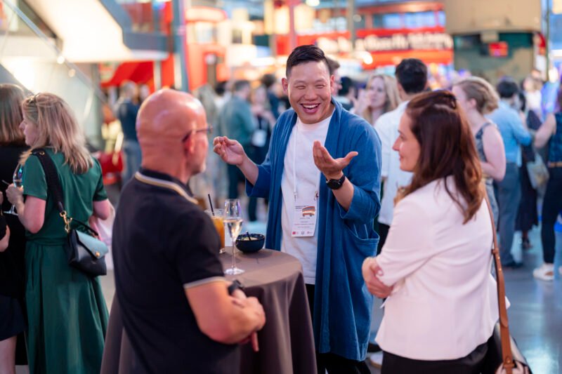 People networking at a lively social event.