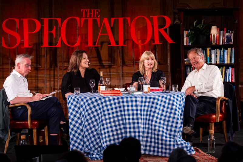 Four people discussing at a Spectator event.