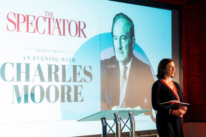 Speaker event with magazine branding and presenter